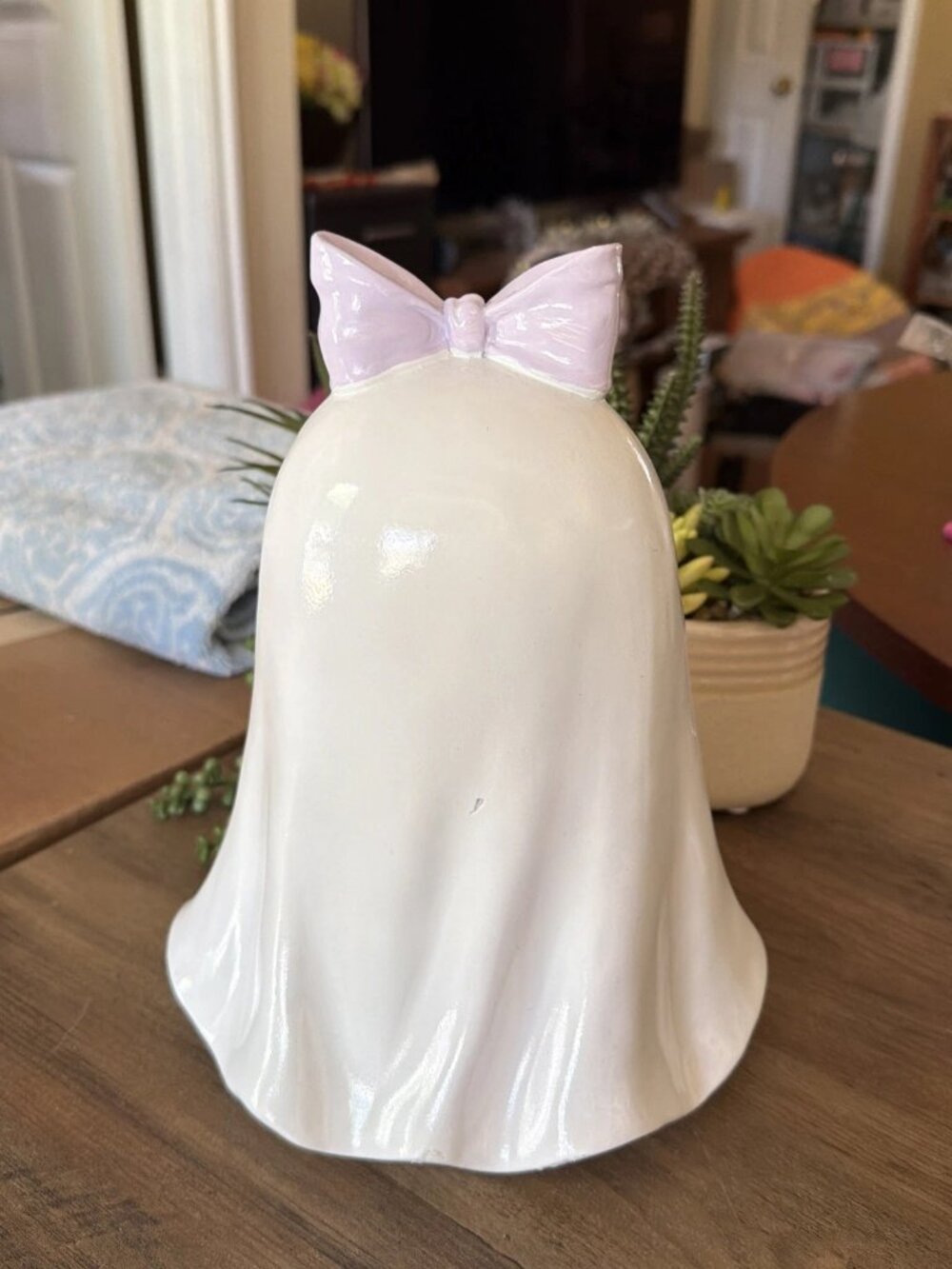 summerween ghost with purple bow serving pastel cupcakes - Picture 4 of 5